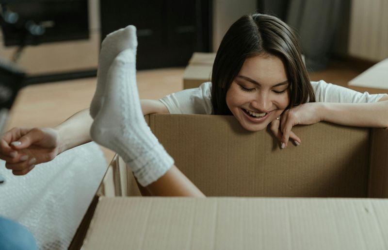 Active person moving in a sunlit studio space