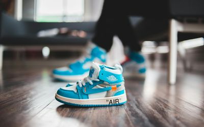 Close up of sneakers on wooden floor