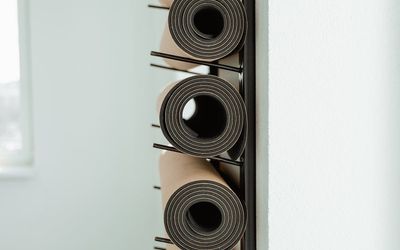 Gym mat rolled up in a corner