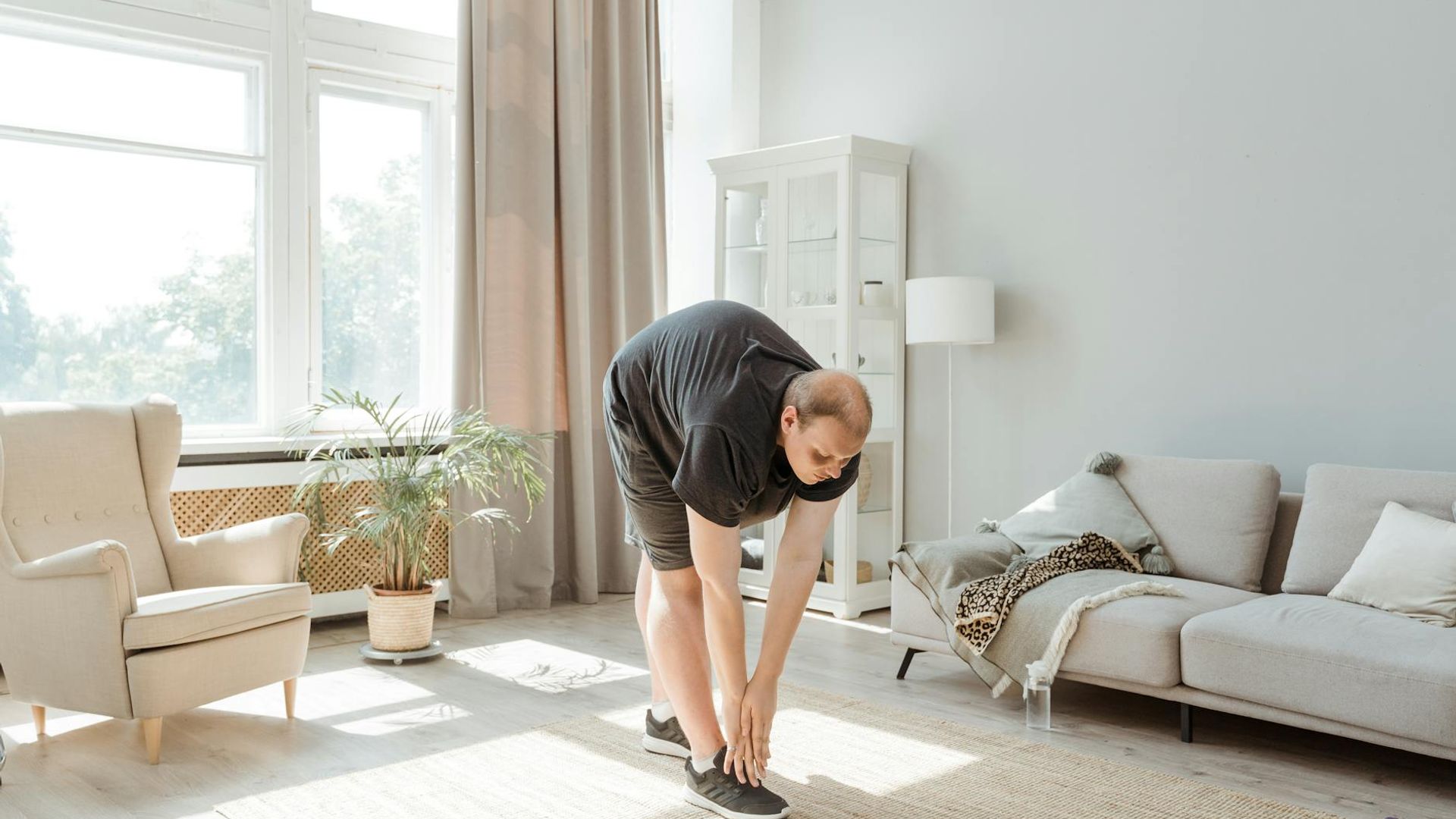Person doing morning exercises in a bright minimalist room